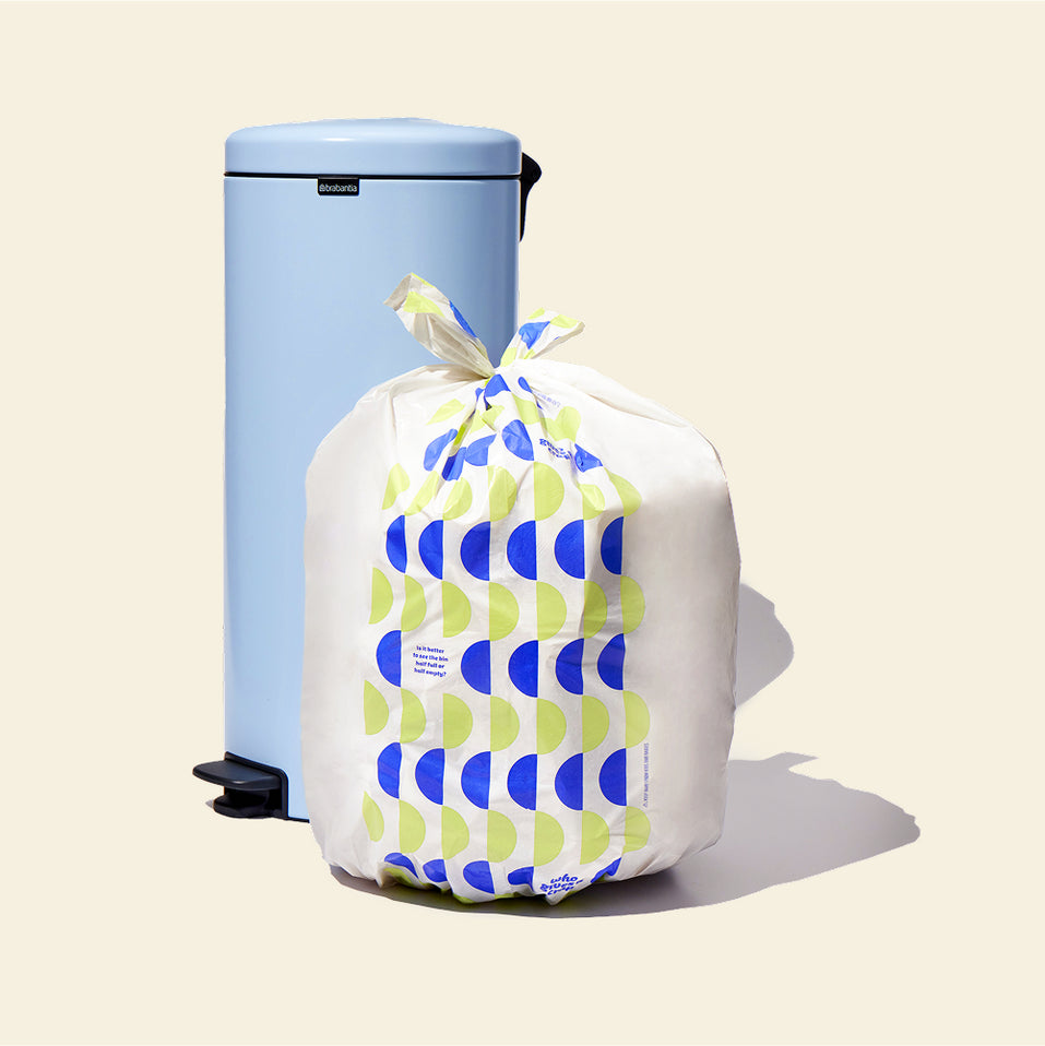 Who Gives a Crap large recycled bin bag sits full next to kitchen bin