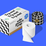 On a bold blue background sits one wrapped roll and one unwrapped roll of bamboo Who Gives a Crap toilet paper next to a trial pack box with Try me printed three times.