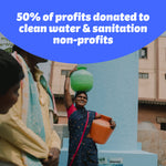 Walking woman carries containers of water on head and hip and smiles. Image by WaterAid (Abhijit). Who Gives A Crap donated 50% of profits to clean water & sanitation non-profits.