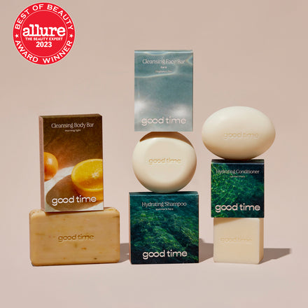 Naked Good Time body bar, face bar, shampoo bar, and conditioner bar are displayed next to their packaging with an Allure Best of Beauty award.