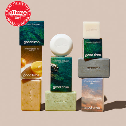 Naked Good Time Shampoo, Conditioner, and three body bars are displayed next to their packaging with an Allure Best of Beauty award.