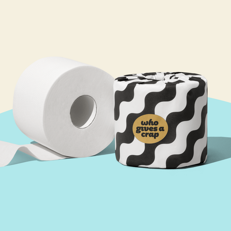 Single roll of Who Gives a Crap bamboo toilet paper wrapped in back and white pattern packaging