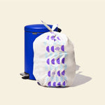 Who Gives a Crap large recycled bin bag sits full next to kitchen bin