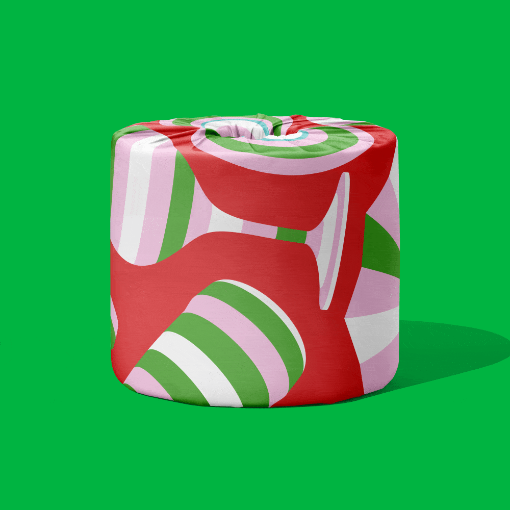 A roll of The Gift Edition toilet paper in a red, pink and green swirl wrapper on a green background.